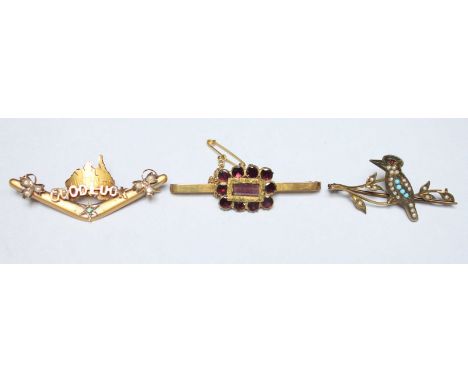 A 9ct gold brooch set with seed pearls and modelled as Australian continent above a boomerang, together with another 9ct seed