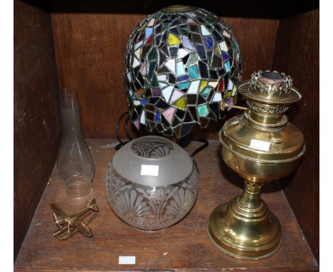 SECTION 52. A Tiffany style table lamp, together with a brass oil lamp, and a brass racing sea plane.