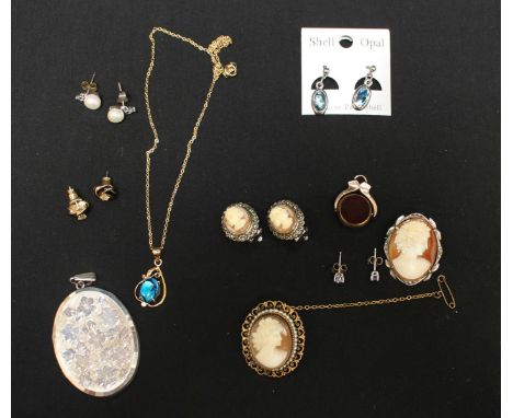 A collection of assorted jewellery including a gold fob seal an opal doublet necklace cameo brooches and other items.