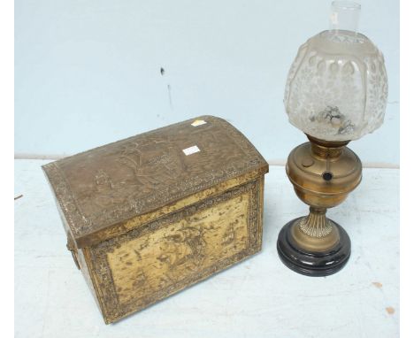 A small embossed brass coal bin, containing a large collection of horse brasses, together with an oil lamp. (2)