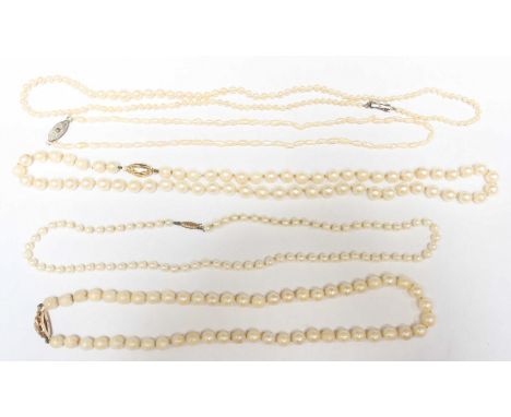 A bag of five assorted pearl necklaces.