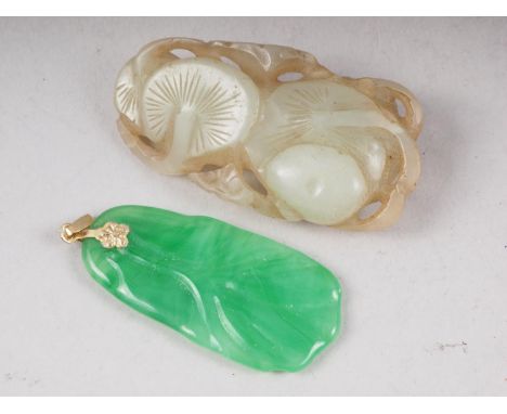 A pale celadon jade carving of two lily pads, and a green coloured pendantCondition:Some surface scratches but no major damag