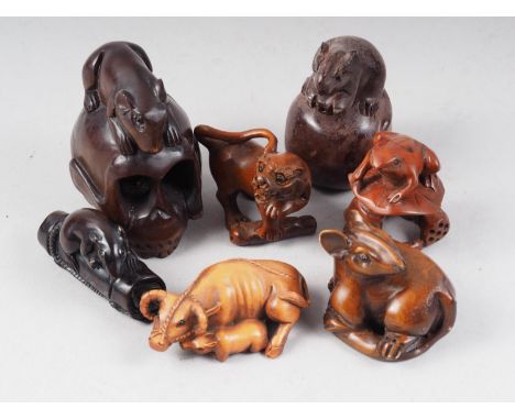 A carved boxwood netsuke water buffalo and calf, four carved hardwood rat netsuke and two others 