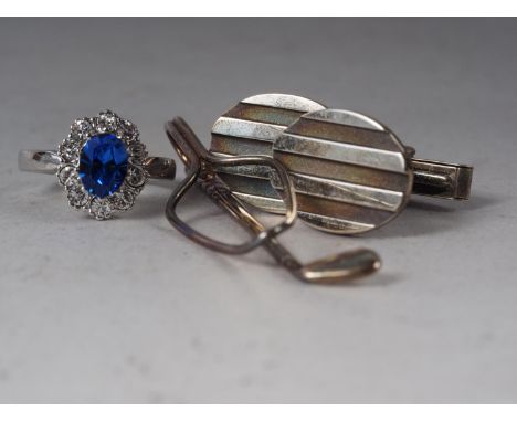 A pair of Tiffany &amp; Co silver cufflinks, a Tiffany &amp; Co silver golf club tie clip and a Swarovski dress ring 