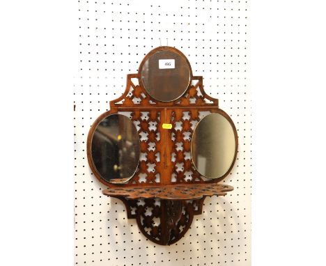 A 19th century walnut fretwork wall triple plate mirror with shelf, 15" wide x 19" high 