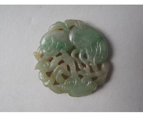 A phoenix carved jade panel, 2 3/4" high, a dragon pierced jade panel, 2 1/4" high, and a smaller green jade peach pierced pa