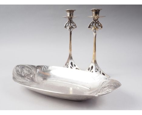 A Gallia pine cone embossed oval platter, 14" wide, and a pair of silver plate Art Nouveau design pillar candlesticks, 9 3/4"