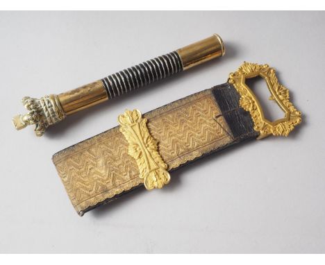 A Georgian ebony and brass tip staff with crown finial, 7 1/2" high, and a gilt metal and leather "buckle" 