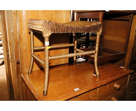 A Lloyd Loom gold sprayed stool with original finish, 19" wide 