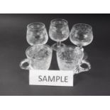 A set of twenty Meissen wheel engraved punch cups and three brandy balloons