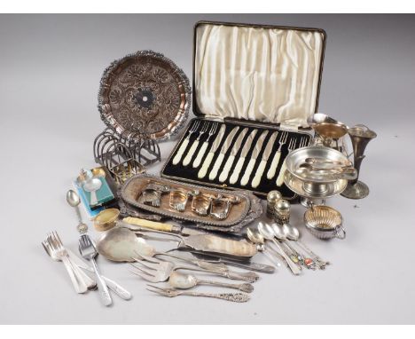 A cased set of six dessert knives and forks, two silver plated toast racks, loose plated flatware and other items 