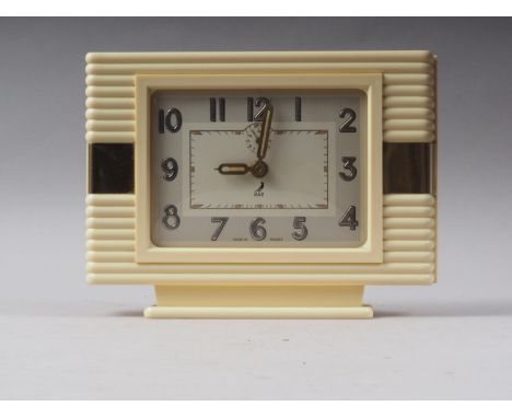 A 1930s Jaz cream plastic alarm clock, 6 1/2" high 