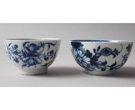Two late 18th century Worcester blue and white tea bowls with floral decoration (larger 3 1/8" dia) 
