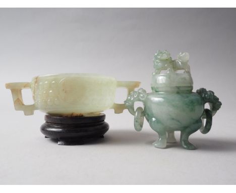 A carved jade two-handled vessel, 4 1/8" wide, on hardwood stand, and a carved jade two-handled jar and cover, 2 1/2" highCon
