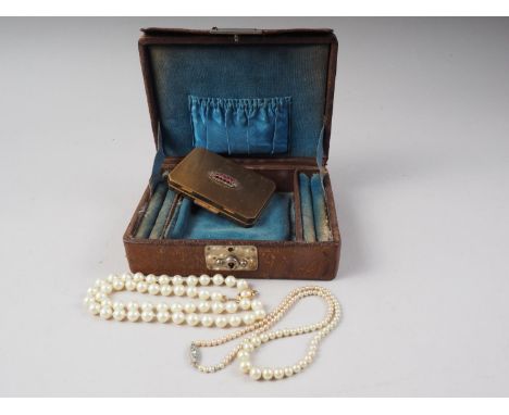 A white metal mounted ostrich skin jewel box, a gilt metal Stratton compact with "jewelled" cover and two faux pearl necklace