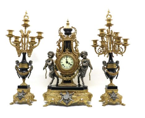 A Louis XV style clock garniture,gilt metal mounted faux black marble, with a single train Franz Hermle movement, the dial in
