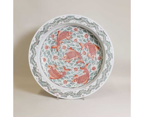 A Chinese famille verte planter,of circular form with a flat everted rim, painted with carps in iron-red enamels among green 