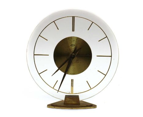 A Kaiser 8 Day desk clock,1950s, with a lucite face and brass details,17.8cm highWorking, some foxing and marks to the brass 