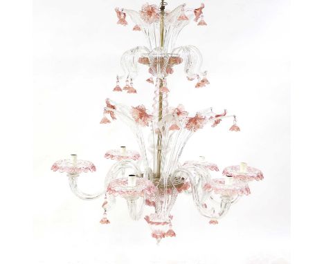 A Murano glass chandelier,the air twist stem decorated with leaves and pink floral drops, leading to six lights,60cm wide80cm