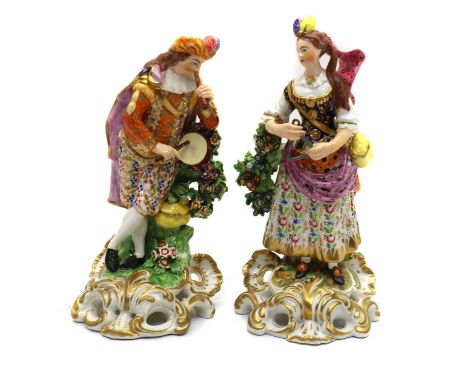 A matched pair of Derby porcelain 'Idyllic Musician' figureslate 18th century, the lady with a pipe and tabor, playing the tr