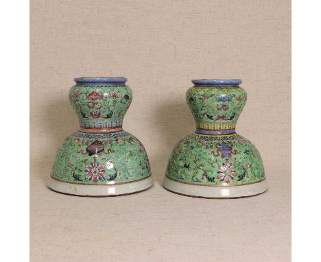 Two Chinese famille rose vases,Qing dynasty (1644-1911), each high domed foot rising to a flared inverted section, painted wi