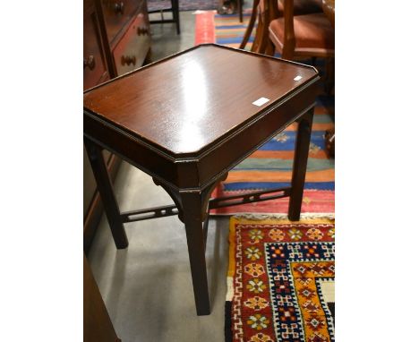 A small mahogany side table with canted rectangular top and frieze drawer raised on chamfered supports united by cross stretc