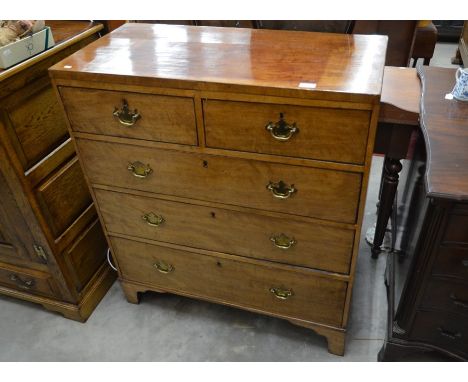 A 19th century mahogany chest of two short over three long drawers with (replacement) brass handles, raised on shaped bracket
