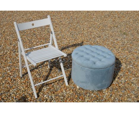 A modern circular ottoman/footstool with buttoned light blue upholstery to/w a white painted folding chair (2)