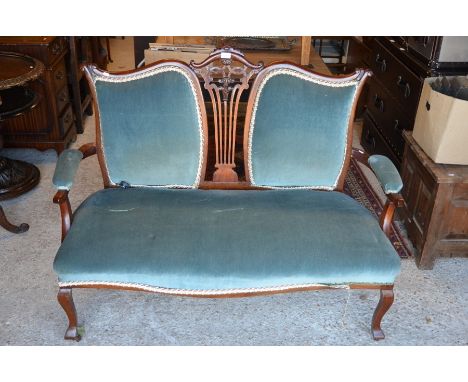 An Edwardian carved mahogany two seater salon settee with light blue dralon upholstery, 133 cm widePlease note that all lots 