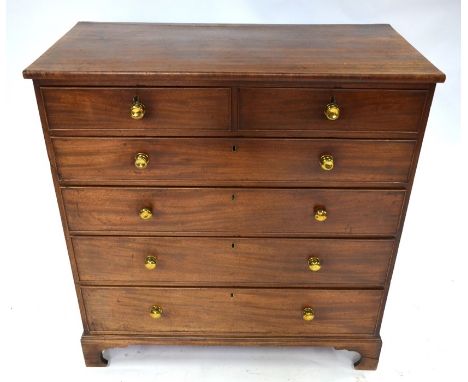 A Georgian mahogany chest of two short over four long graduated drawers, with cockbeaded edges and turned brass fittings, rai