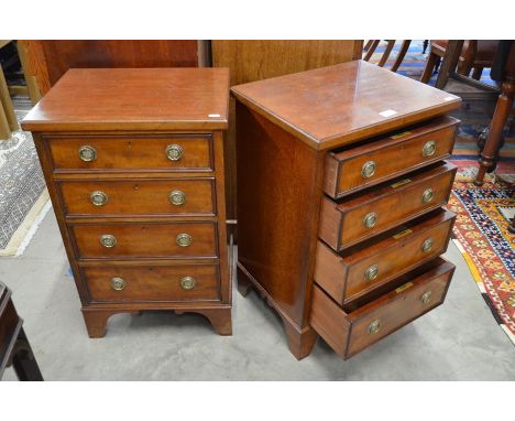 A pair of good quality mahogany bedside cabinets each fitted with four graduated drawers having brass ring handles, raised on