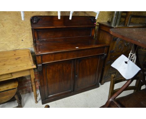 A Victorian mahogany chiffonier with carved mouldings, single full width drawer over pair of panelled cupboard doors 120 cm w