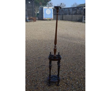 A turned mahogany hall stand with integrated oak four division circular stick standPlease note that all lots are second hand 