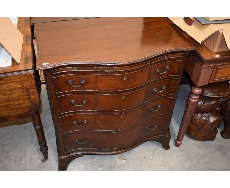 A Georgian style mahogany serpentine-front chest, moulded top over slide and four long drawers raised on shaped bracket feet,