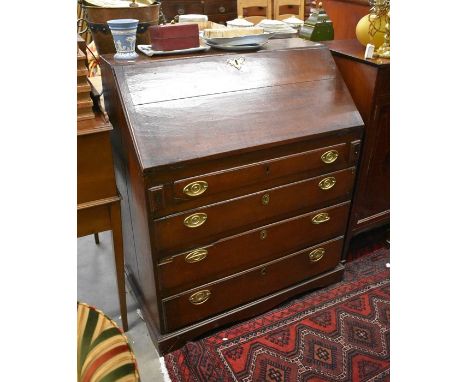 An 18th century oak fall front bureau with fitted interior, four long graduating drawers raised on bracket feet, a/f, 110 cm 