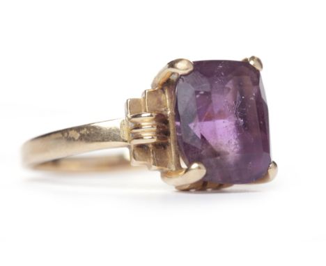 MID TWENTIETH CENTURY AMETHYST SINGLE STONE RINGset with an oval amethyst 9.9mm long, on stepped shoulders, in eighteen carat