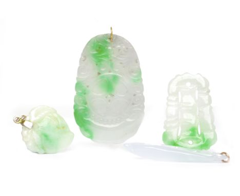 FOUR JADE PENDANTSthree with carved decoration including a leaf motif example, all lacking chains or laces, 34g gross