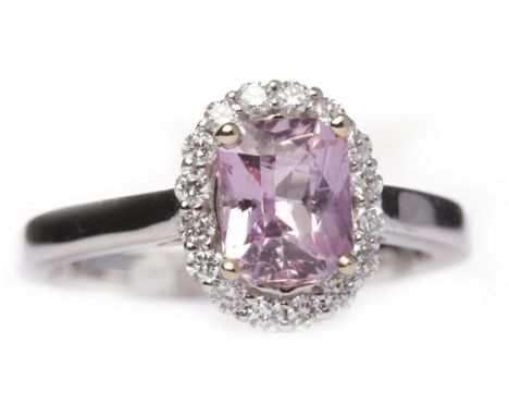 EIGHTEEN CARAT WHITE GOLD PINK SAPPHIRE AND DIAMOND DRESS RINGthe central radiant cut pink sapphire 6.7mm long and surrounded