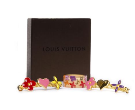 LOUIS VUITTON RING AND BARETTE SETthe acrylic ring with Louis Vuitton and flower motifs, size K; along with two hair barettes