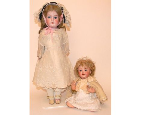 Simon & Halbig 126 bisque head baby, German circa 1910, with weighted blue glass eyes, open mouth, two upper teeth and blonde