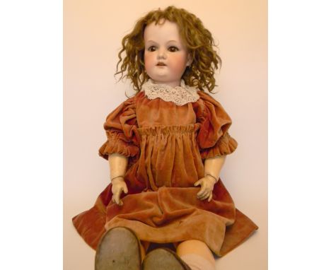 Large A.M bisque head doll, size 14, German circa 1910, with weighted brown glass eyes, lashes, open mouth, upper teeth and o