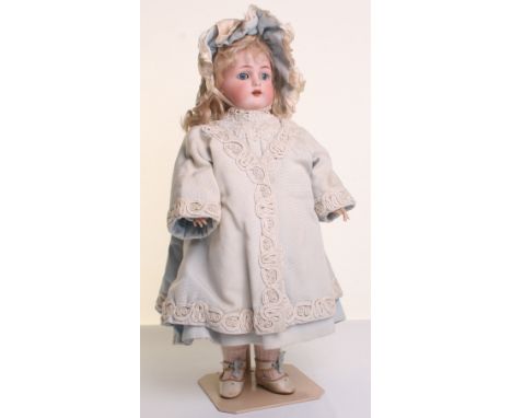 Kammer & Reinhardt bisque head doll, with weighted blue glass eyes, open mouth, upper teeth, pierced ears and original blonde