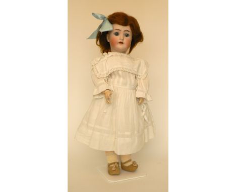 Simon & Halbig bisque head doll, German circa 1910, with weighted blue glass eyes, open mouth, upper teeth and auburn hair, o