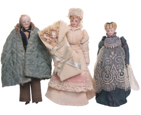 Three German bisque head Dolls House dolls, all with painted feature and moulded hair on cloth bodies with bisque lower arms 