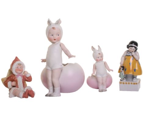 Collection of Heubach bisque Easter figurines, including little girl in Bunny costume standing in front of pink painted egg, 