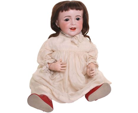 A large S.F B.J 236 ‘laughing Jumeau’ bisque head character doll, with weighted brown glass eyes, smiling open/closed mouth w