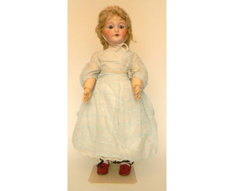 S.F.B.J 301 bisque head doll, French circa 1910, with weighted blue glass eyes, open mouth, upper teeth and blonde curly hair