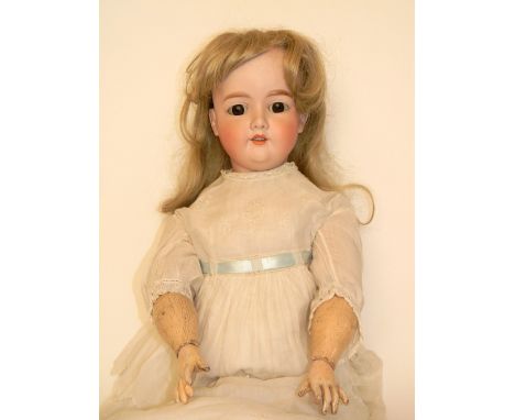 A.M 390 bisque head doll, German circa 1910, with fixed brown glass eyes, open mouth, upper teeth and blonde hair, on a fully