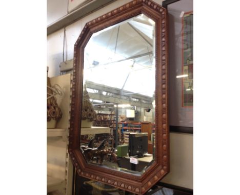 AN OAK FRAMED MIRROR, 63.5CM X 88CM. R