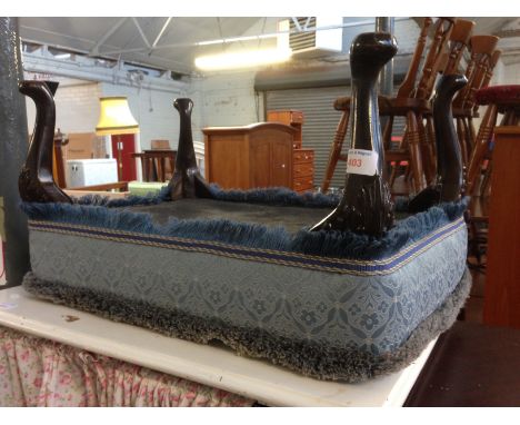 A BLUE UPHOLSTERED FOOT STOOL